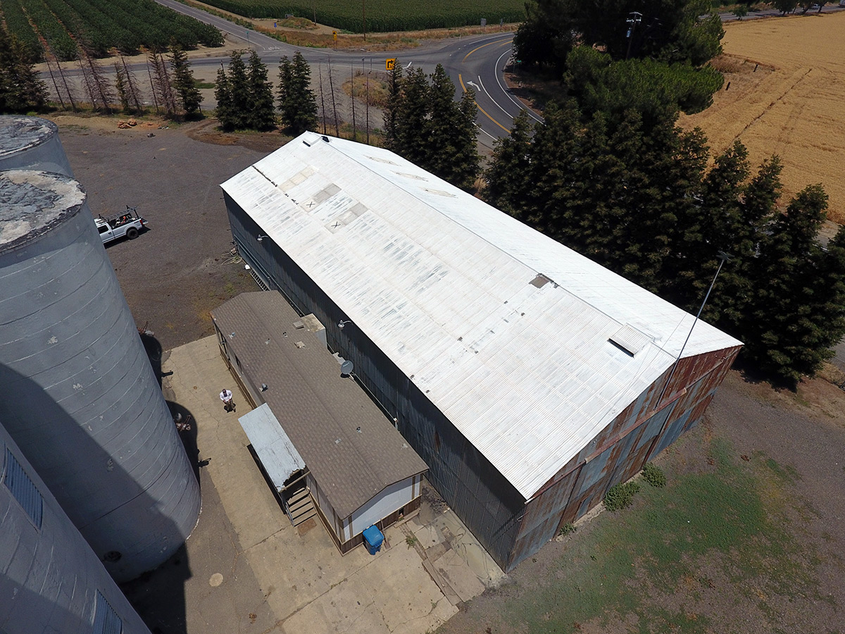 old metal building before new roof and painting